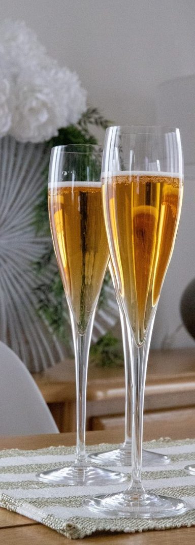 Two flutes of sparkling cider